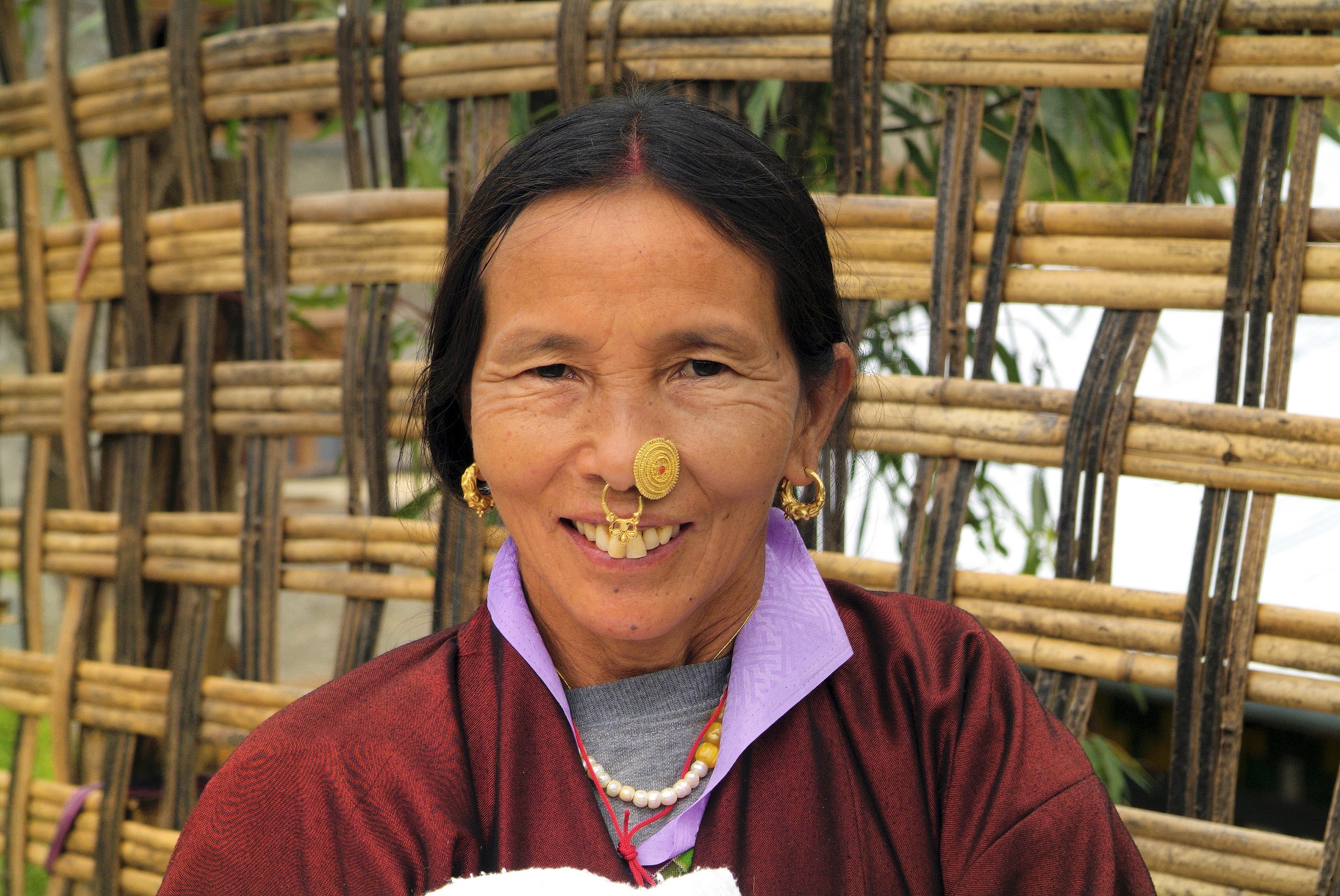 Kurje, Bumthang, Bhutan - September 26, 2007: Unidentified woman with tradittional jewelry in nose and ear