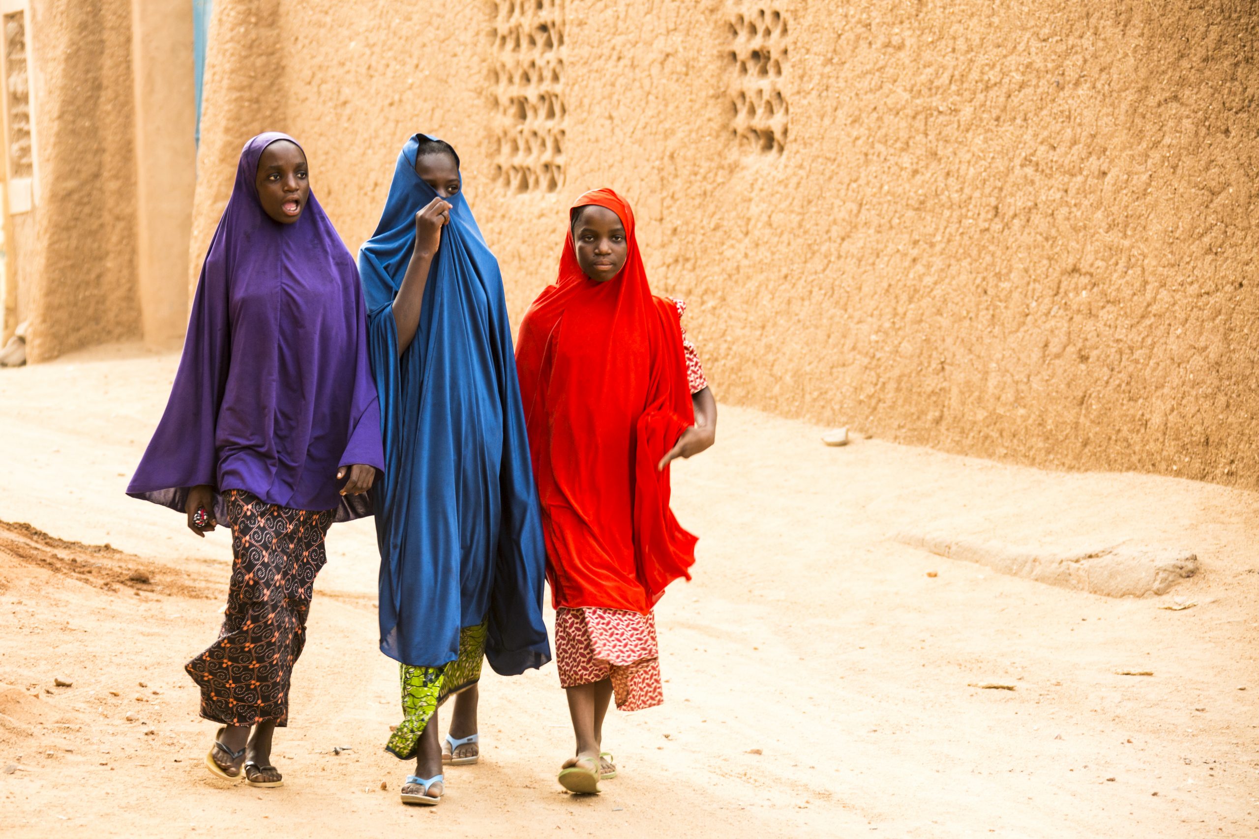 Colorful group of woman walking in the roads of Agadez